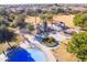 Community playground featuring play structures, shade ramadas, and a splash pad for outdoor fun at 43344 W Oster Dr, Maricopa, AZ 85138