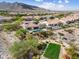 Fantastic aerial view of home with pool, spa, outdoor kitchen, and mountain views at 5033 N 205Th Gln, Buckeye, AZ 85396