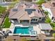 Expansive aerial view of backyard with pool, spa, fire pit and outdoor kitchen at 5033 N 205Th Gln, Buckeye, AZ 85396