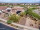 Beautiful aerial view of a Southwestern home with solar panels and a manicured lawn, backing up to the golf course at 5033 N 205Th Gln, Buckeye, AZ 85396