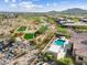 Beautiful aerial view of desert home with pool, spa, and mountain views at 5033 N 205Th Gln, Buckeye, AZ 85396