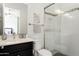 Modern bathroom featuring a glass-enclosed shower and stylish fixtures for a spa-like experience at 5033 N 205Th Gln, Buckeye, AZ 85396