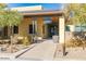 Charming clubhouse entrance featuring modern architecture and serene landscaping at 5033 N 205Th Gln, Buckeye, AZ 85396
