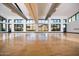 Spacious event space with hardwood floors, large windows, and stunning mountain views at 5033 N 205Th Gln, Buckeye, AZ 85396