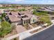 Beautiful exterior elevation of a home featuring a tile roof, arched entryway, and manicured landscaping at 5033 N 205Th Gln, Buckeye, AZ 85396