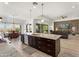 Modern kitchen featuring a large island with bar seating, stainless steel appliances, and an open floor plan at 5033 N 205Th Gln, Buckeye, AZ 85396