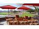 Cozy outdoor lounge area with comfortable seating and golf course views at 5033 N 205Th Gln, Buckeye, AZ 85396