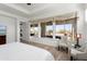 This main bedroom features large view windows overlooking an inviting backyard at 5033 N 205Th Gln, Buckeye, AZ 85396