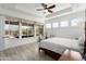 A spacious main bedroom with tray ceiling has a great view of the backyard at 5033 N 205Th Gln, Buckeye, AZ 85396