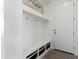 Functional mud room with built-in storage and hooks, offering organization and convenience at 5033 N 205Th Gln, Buckeye, AZ 85396
