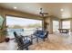 Expansive outdoor living space with comfortable seating, a pool, and stunning desert views at 5033 N 205Th Gln, Buckeye, AZ 85396