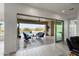 Inviting outdoor patio with a pristine pool view through large sliding glass doors at 5033 N 205Th Gln, Buckeye, AZ 85396