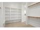 An organized walk-in closet provides ample storage and shelving space at 5033 N 205Th Gln, Buckeye, AZ 85396