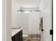 Bright bathroom with a shower/tub combination, toilet, and simple vanity area at 51134 W Bluejay St, Maricopa, AZ 85139