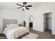 Cozy bedroom with neutral tones, carpet flooring, and a ceiling fan at 51134 W Bluejay St, Maricopa, AZ 85139