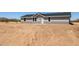 Inviting home exterior with desert landscaping and a well-maintained yard at 51134 W Bluejay St, Maricopa, AZ 85139