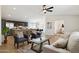 Inviting living room with stylish furniture, ceiling fan, and an open floor plan at 51134 W Bluejay St, Maricopa, AZ 85139