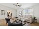 Bright living room featuring modern furniture, ample light, and an open layout at 51134 W Bluejay St, Maricopa, AZ 85139