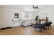 Comfortable living room with modern decor, a ceiling fan, and ample natural light at 51134 W Bluejay St, Maricopa, AZ 85139