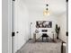 Bright home office with a modern desk, stylish decor, and carpet flooring at 51134 W Bluejay St, Maricopa, AZ 85139