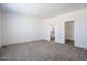 Spacious bedroom features neutral carpet, recessed lighting, a walk-in closet and en-suite bath at 51942 W Sotol Rd, Maricopa, AZ 85139