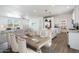 Open concept view of the dining room and kitchen feature modern finishes and lots of natural light at 51942 W Sotol Rd, Maricopa, AZ 85139