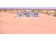 Charming single story home with a gray roof and matching trim in a desert landscape at 51942 W Sotol Rd, Maricopa, AZ 85139