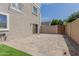 Spacious backyard featuring pavers, synthetic grass and secure fencing at 5232 N 16Th Ln, Phoenix, AZ 85015