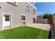 A view of a home's backyard with grass and pavers at 5232 N 16Th Ln, Phoenix, AZ 85015