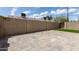Private backyard featuring pavers, synthetic grass and a privacy wall at 5232 N 16Th Ln, Phoenix, AZ 85015