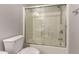 Bathroom featuring a toilet and a shower with a glass door at 5232 N 16Th Ln, Phoenix, AZ 85015