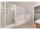 This bathroom features a shower, a tub and tile floors plus a walk-in closet at 5232 N 16Th Ln, Phoenix, AZ 85015