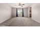 The bedroom features carpet floors, a ceiling fan and a large window at 5232 N 16Th Ln, Phoenix, AZ 85015