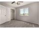 Bedroom featuring neutral carpet, a window with blinds, and a closet at 5232 N 16Th Ln, Phoenix, AZ 85015