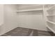 The walk-in closet features carpet floors and white storage shelves and clothing rods at 5232 N 16Th Ln, Phoenix, AZ 85015
