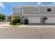 Street view of townhome featuring a two-car garage and manicured front yard at 5232 N 16Th Ln, Phoenix, AZ 85015