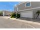 A street view showing a light gray home with an attached two-car garage and fresh landscaping at 5232 N 16Th Ln, Phoenix, AZ 85015