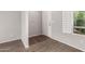 Entryway featuring neutral walls, wood flooring, and a window with natural light at 5232 N 16Th Ln, Phoenix, AZ 85015