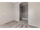 Hallway featuring neutral paint, carpet flooring, and an open staircase at 5232 N 16Th Ln, Phoenix, AZ 85015