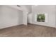 Open living room with a two-story ceiling, updated flooring, and natural light at 5232 N 16Th Ln, Phoenix, AZ 85015
