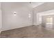 Bright and airy living room with updated flooring, modern sconces, and neutral decor at 5232 N 16Th Ln, Phoenix, AZ 85015