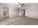 Spacious bedroom has neutral carpet, a ceiling fan and access to the bathroom at 5232 N 16Th Ln, Phoenix, AZ 85015