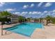 An outdoor pool with mature trees, seating, and bar area at 5232 N 16Th Ln, Phoenix, AZ 85015
