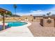 Backyard retreat with a refreshing pool, shed, and low-maintenance landscaping at 5320 W Maui Ln, Glendale, AZ 85306