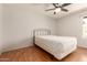 Bright bedroom features a ceiling fan and natural light from the window at 5320 W Maui Ln, Glendale, AZ 85306