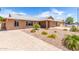 Inviting single-story home featuring desert landscaping and a paved driveway at 5320 W Maui Ln, Glendale, AZ 85306
