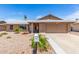 Charming single-story home with a two-car garage, desert landscaping, and beautiful curb appeal at 5320 W Maui Ln, Glendale, AZ 85306