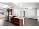 Kitchen island featuring granite countertops and a stainless steel appliance at 5320 W Maui Ln, Glendale, AZ 85306