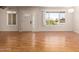Bright living room featuring gleaming hardwood floors and ample natural light at 5320 W Maui Ln, Glendale, AZ 85306