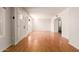 Bright living room featuring gleaming hardwood floors and ample natural light at 5320 W Maui Ln, Glendale, AZ 85306